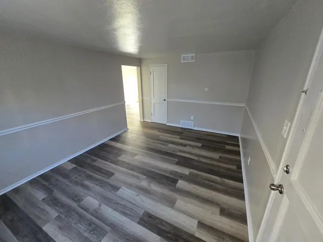 a view of an empty room and stairs