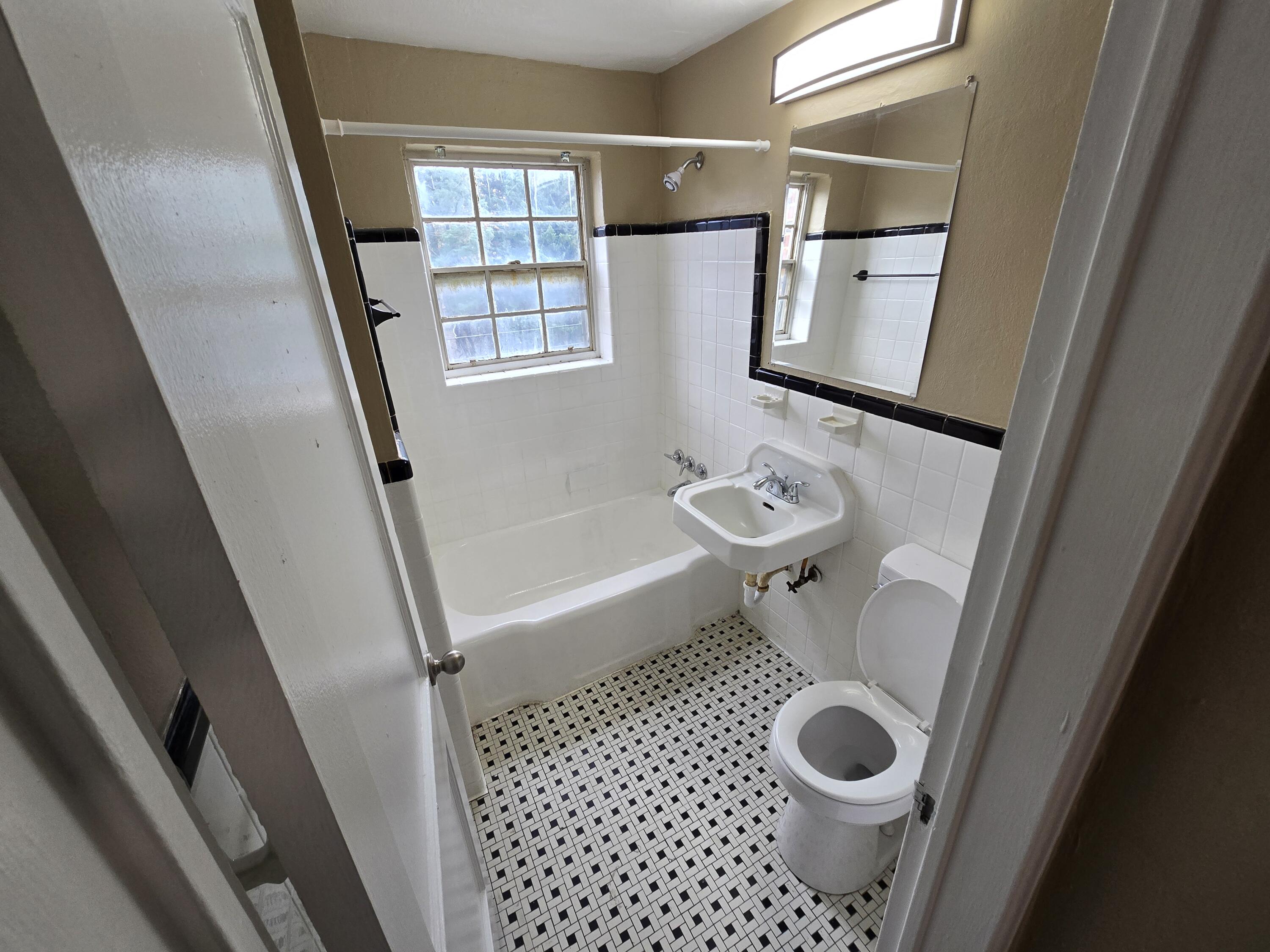 1720 Grandin Road Southwest, Unit 21 Roanoke, VA 24015 - Photo 6 of 6 a bathroom with a sink and a mirror