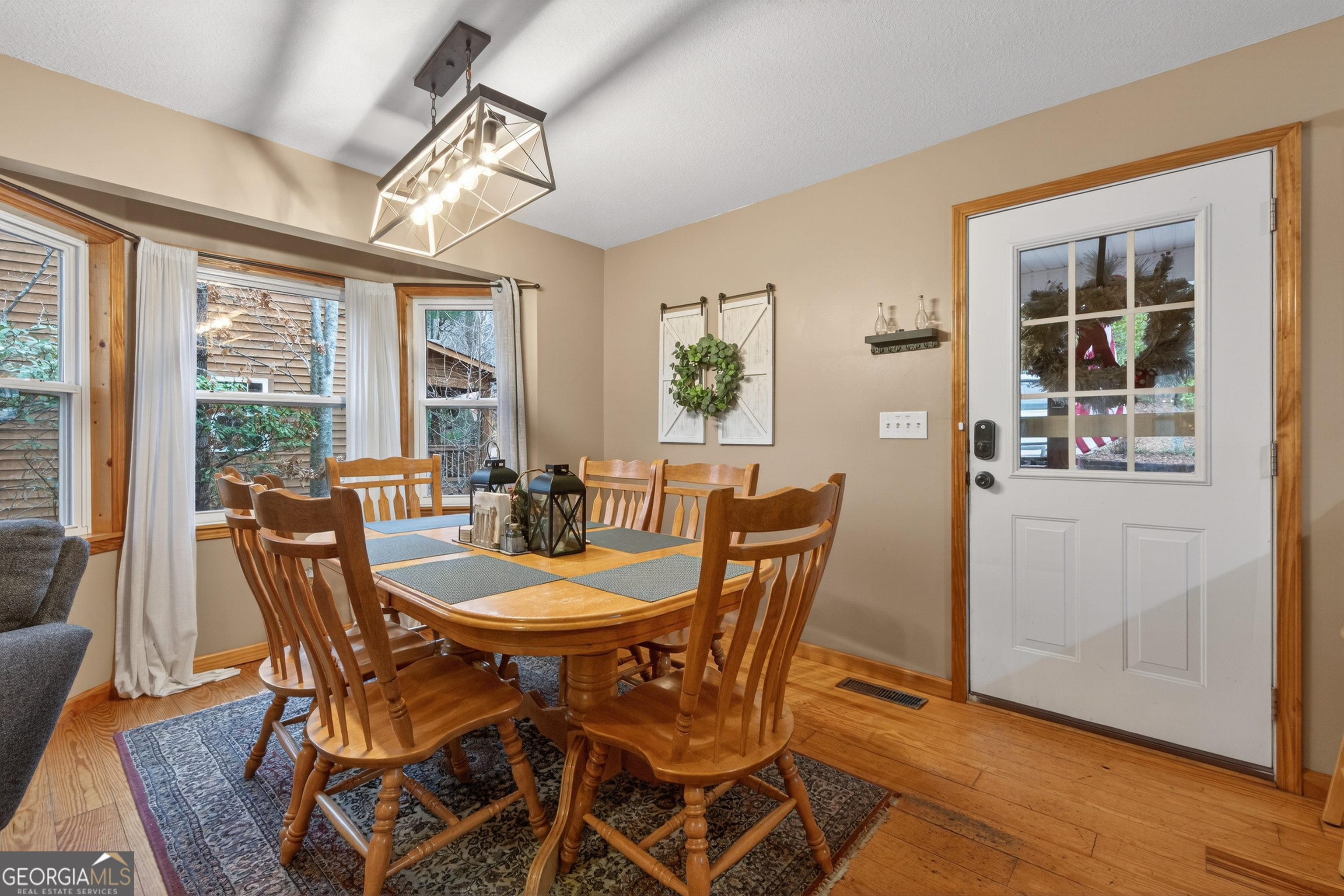 697 Zeppelin Strasse Helen, GA 30545 - Photo 11 of 56 a view of a dining room with furniture window and outside view