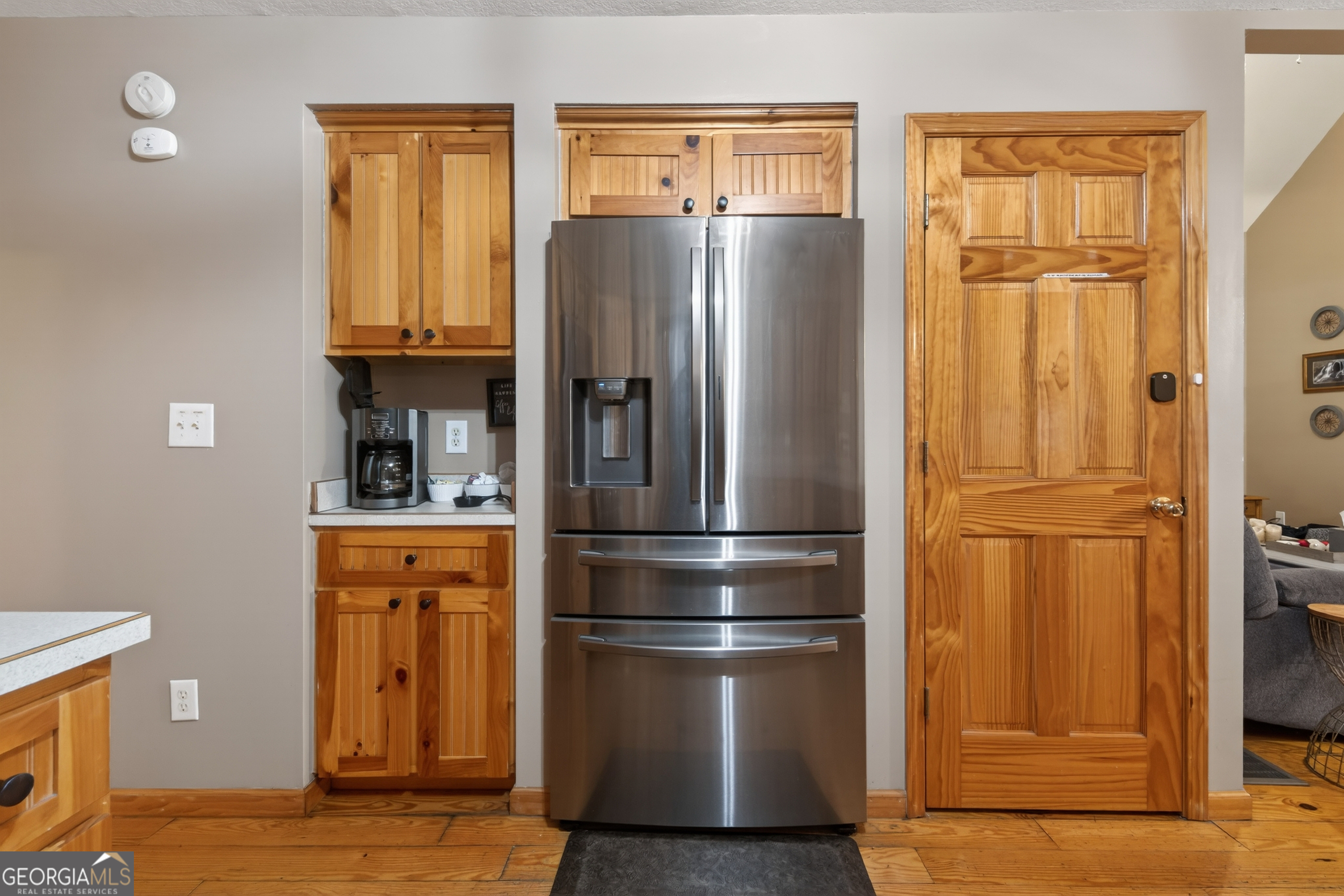 697 Zeppelin Strasse Helen, GA 30545 - Photo 16 of 56 a kitchen with stainless steel appliances a refrigerator and a wooden floor