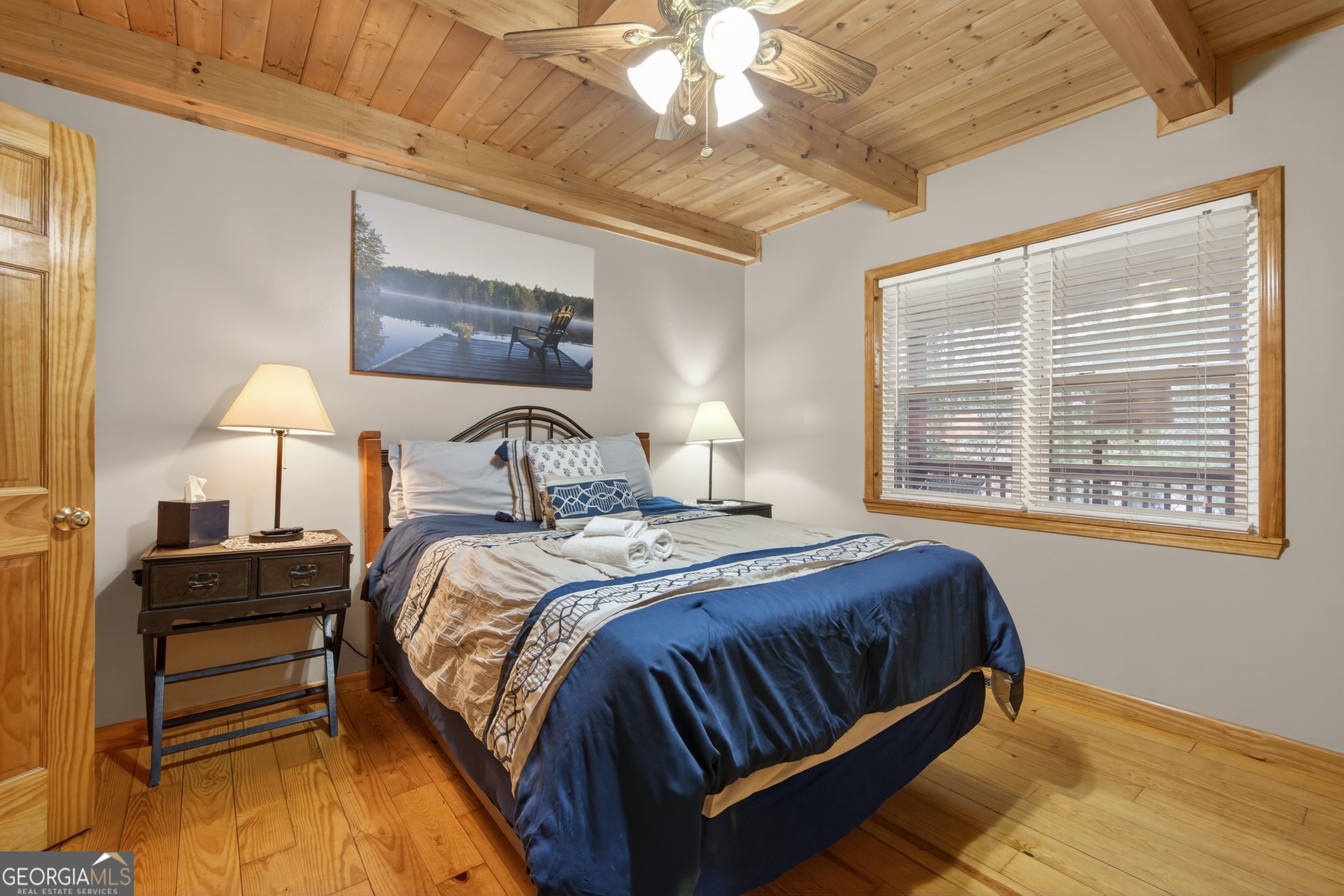 697 Zeppelin Strasse Helen, GA 30545 - Photo 17 of 56 a bedroom with a bed two lamps and a large window