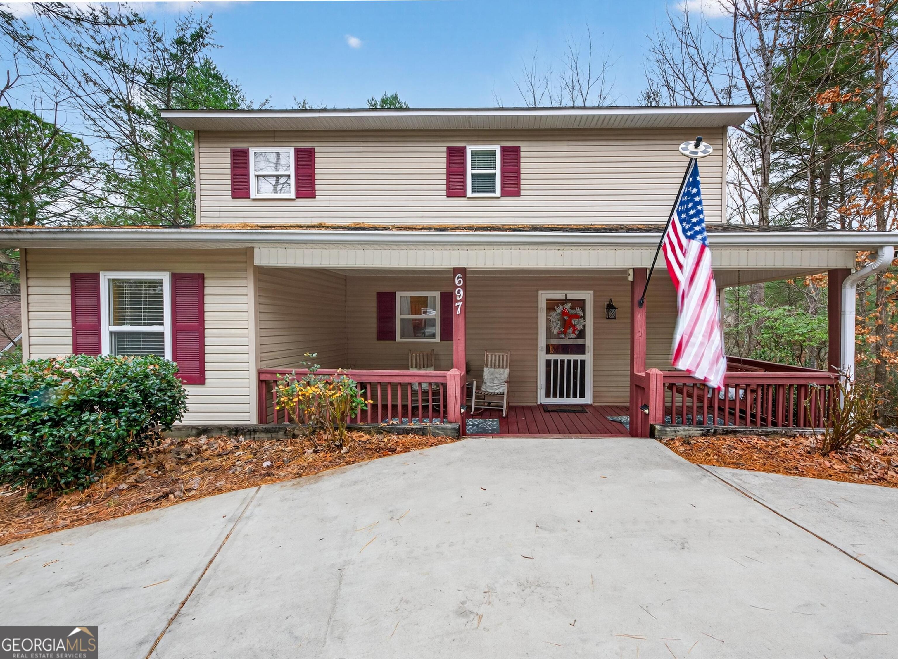 697 Zeppelin Strasse Helen, GA 30545 - Photo 2 of 56 a front view of a house with garden