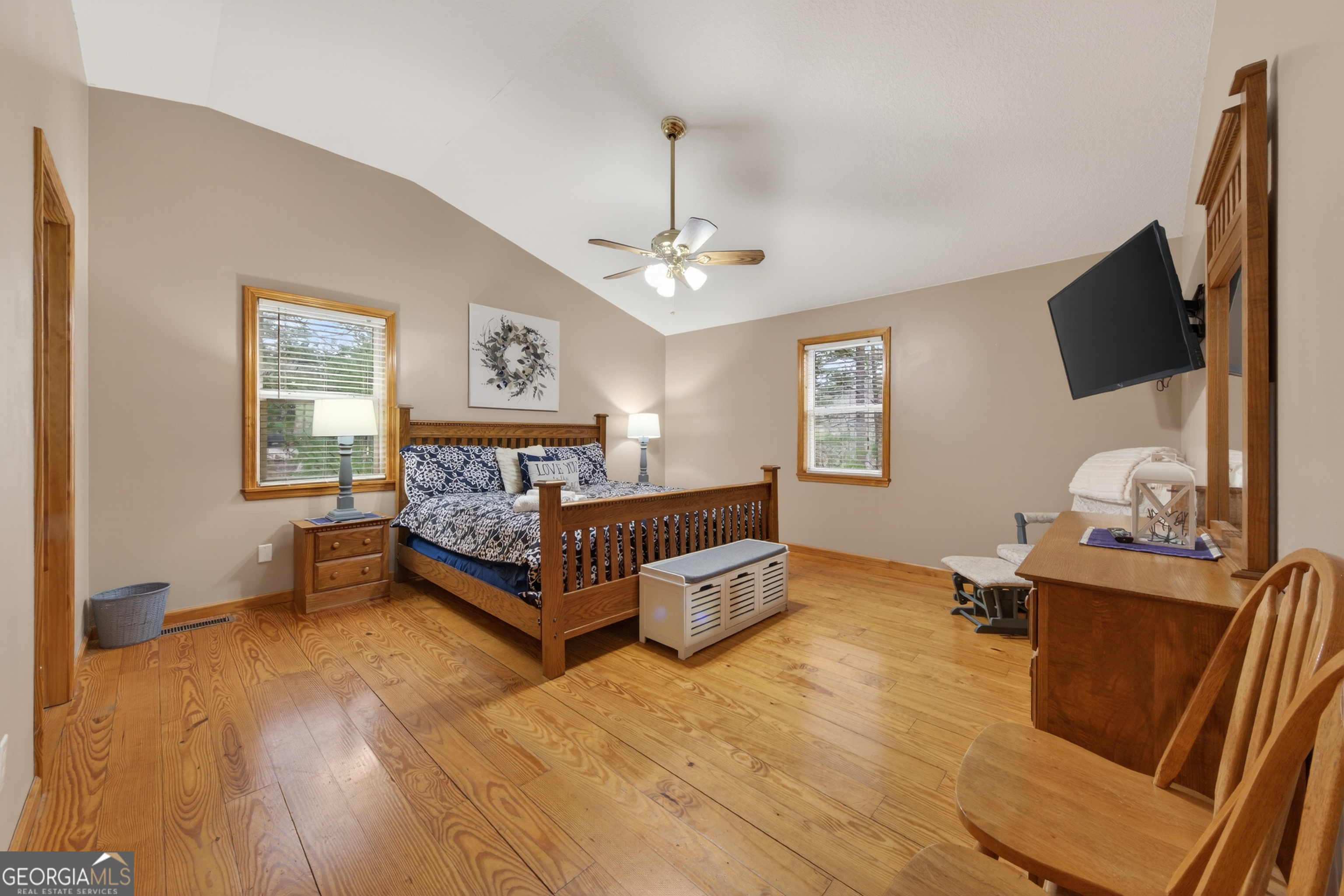 697 Zeppelin Strasse Helen, GA 30545 - Photo 26 of 56 a spacious bedroom with a bed and a flat screen tv