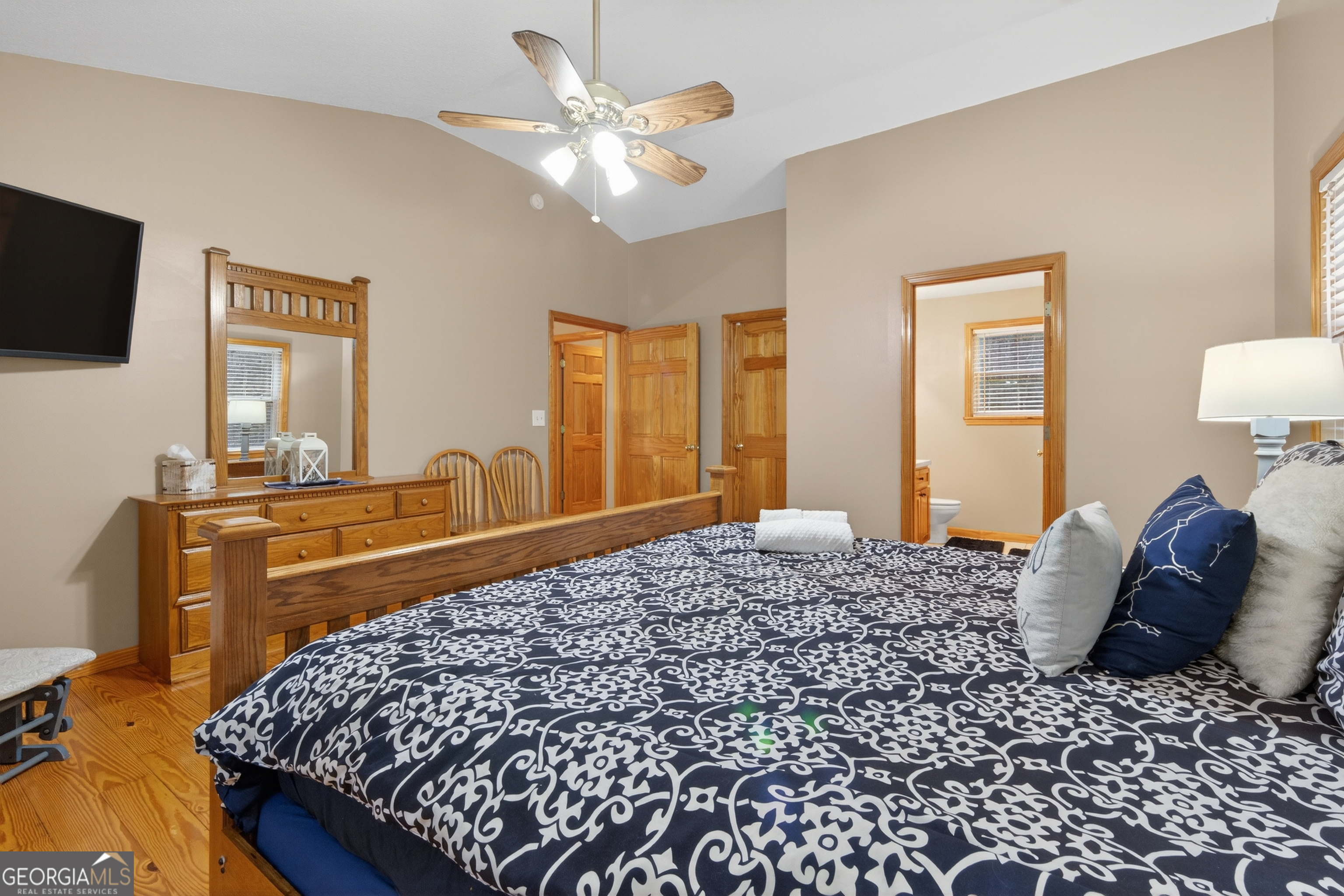 697 Zeppelin Strasse Helen, GA 30545 - Photo 27 of 56 a bedroom with a bed and dresser with mirror
