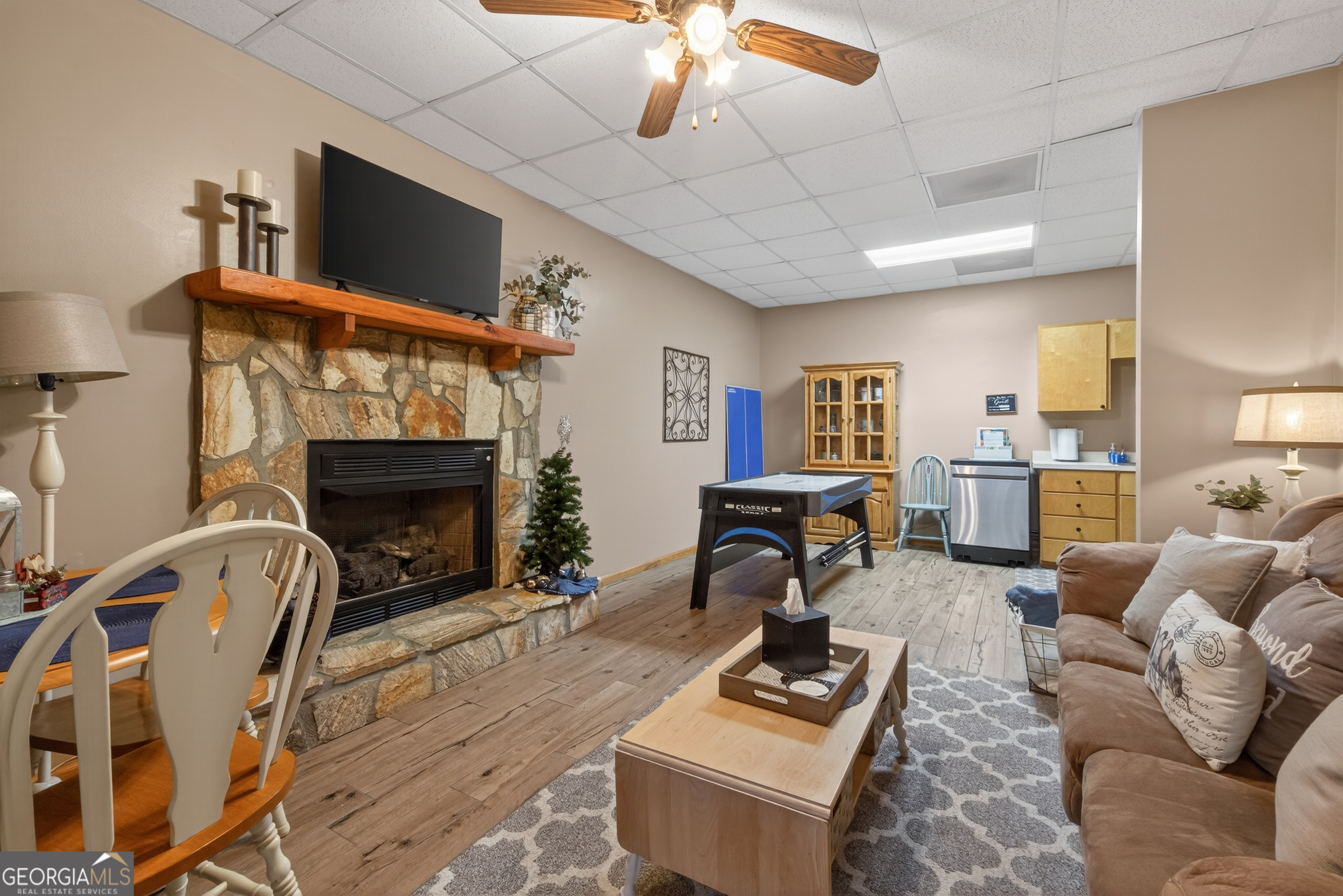 697 Zeppelin Strasse Helen, GA 30545 - Photo 31 of 56 a living room with furniture a fireplace and a flat screen tv