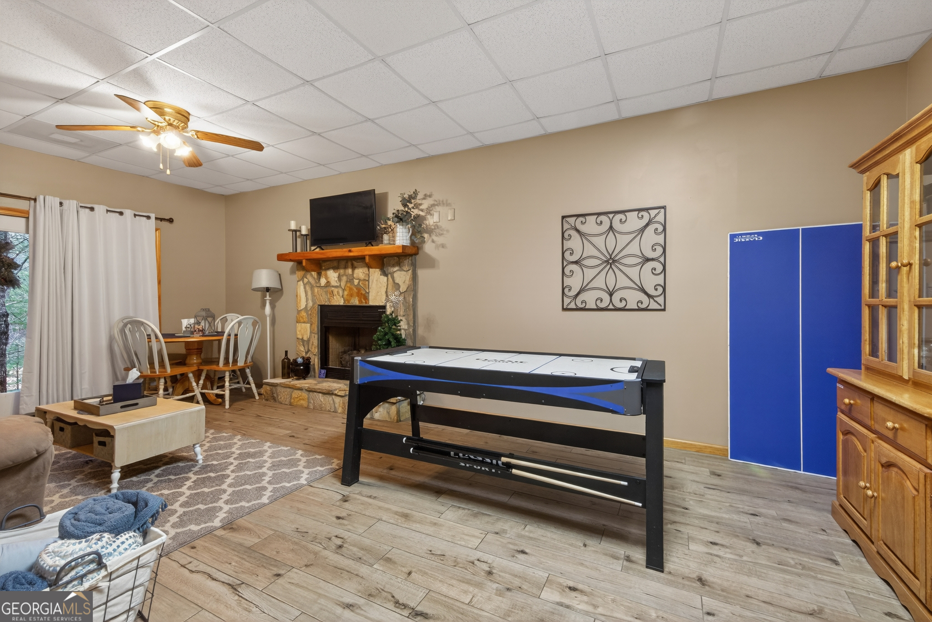 697 Zeppelin Strasse Helen, GA 30545 - Photo 35 of 56 a living room with furniture a flat screen tv and kitchen view