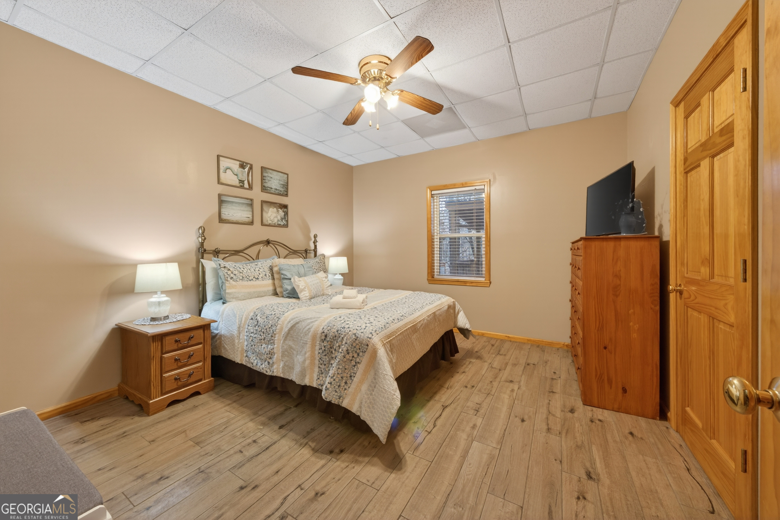 697 Zeppelin Strasse Helen, GA 30545 - Photo 37 of 56 a bedroom with a bed and a ceiling fan