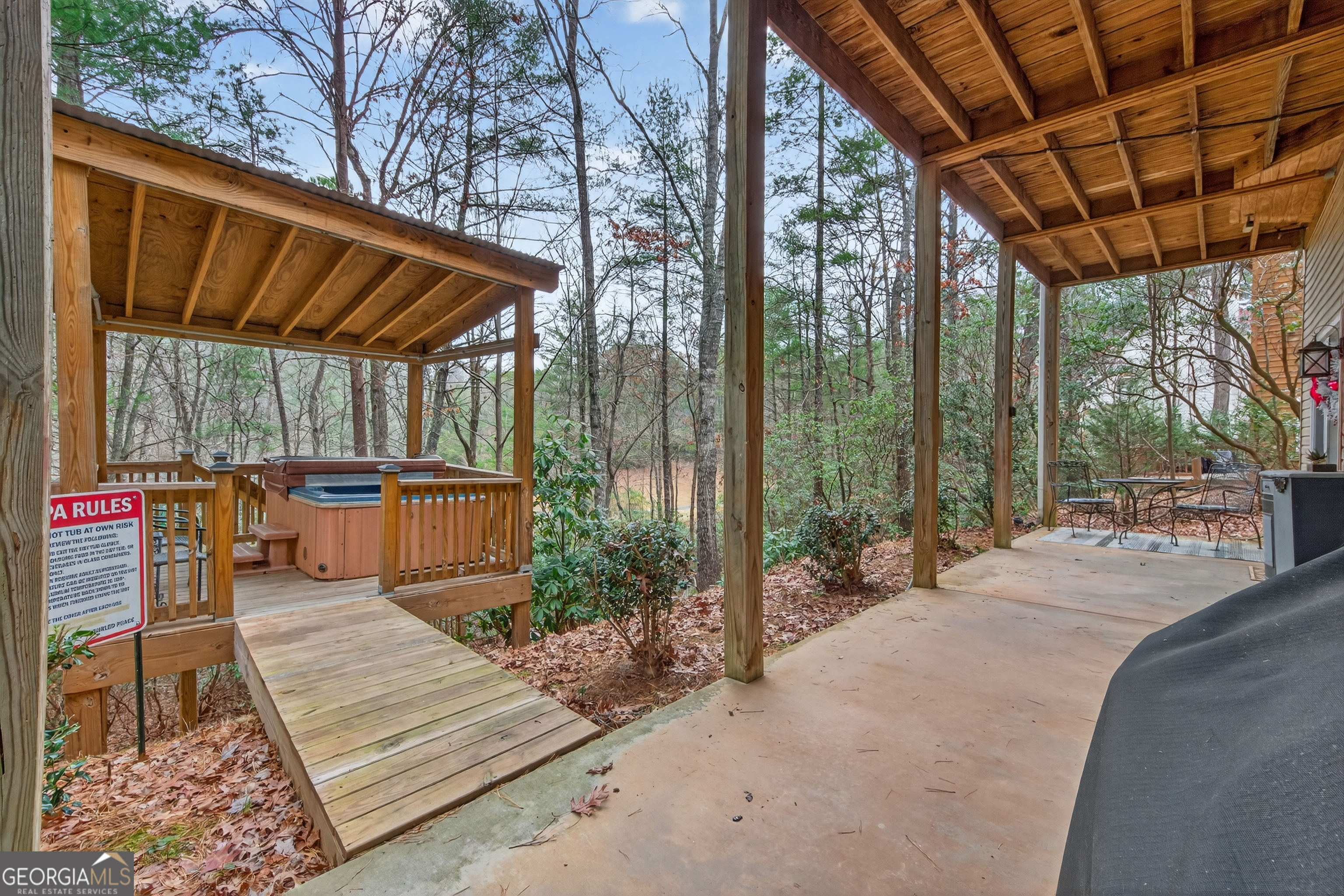 697 Zeppelin Strasse Helen, GA 30545 - Photo 41 of 56 a house view with a sitting space and garden view