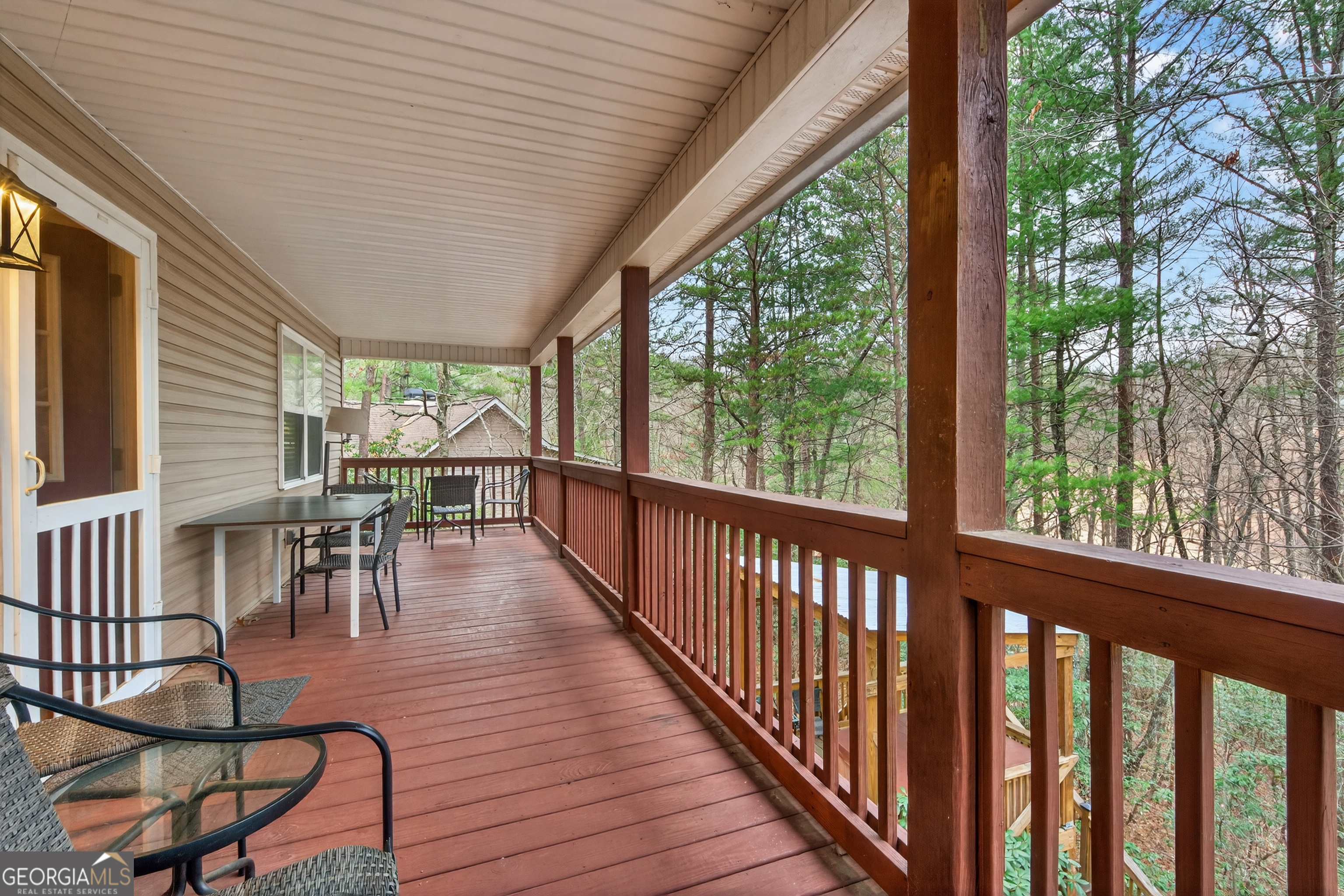 697 Zeppelin Strasse Helen, GA 30545 - Photo 5 of 56 a view of a chairs and table on the wooden deck