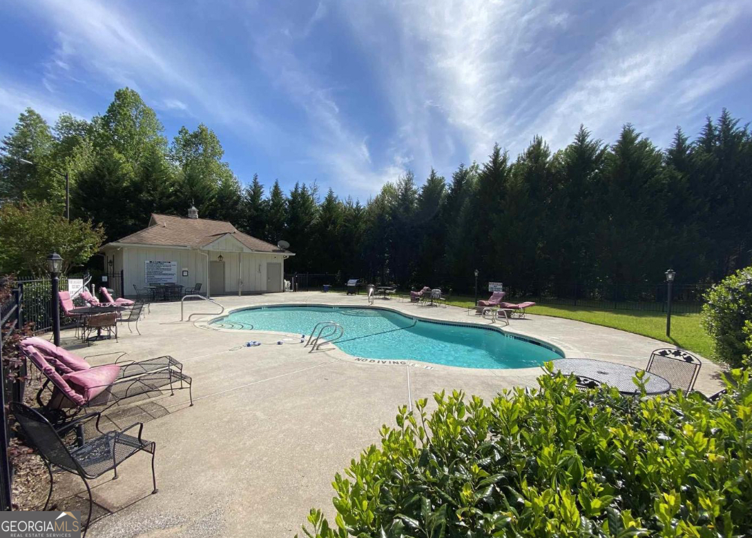697 Zeppelin Strasse Helen, GA 30545 - Photo 55 of 56 a view of backyard with swimming pool and outdoor seating