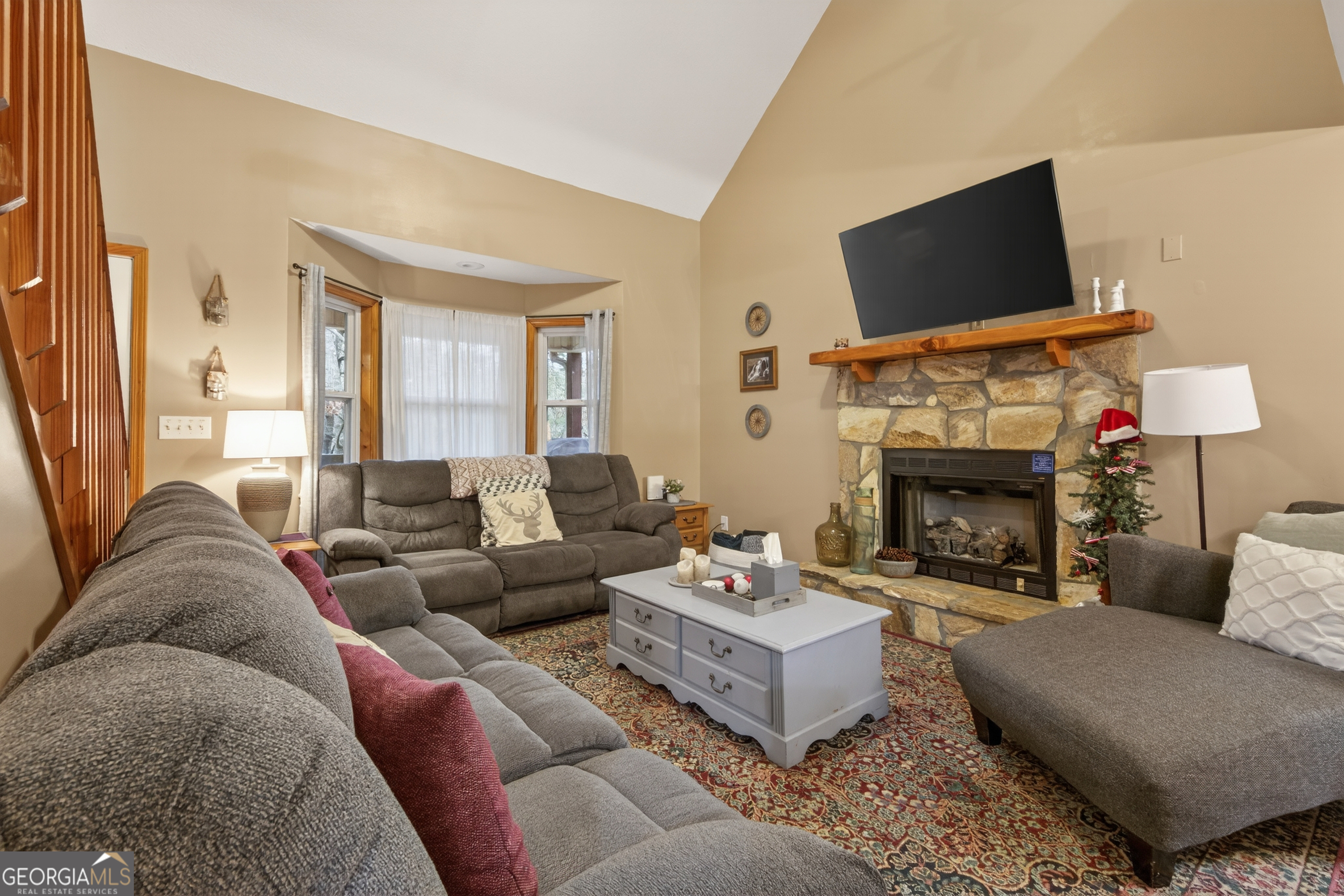 697 Zeppelin Strasse Helen, GA 30545 - Photo 7 of 56 a living room with furniture a fireplace and a flat screen tv