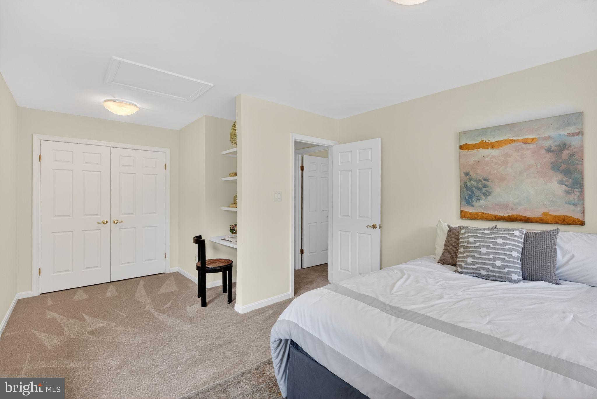 13821 Esworthy Road Darnestown, MD 20874 - Photo 22 of 98 a bedroom with a bed and a painting on the wall