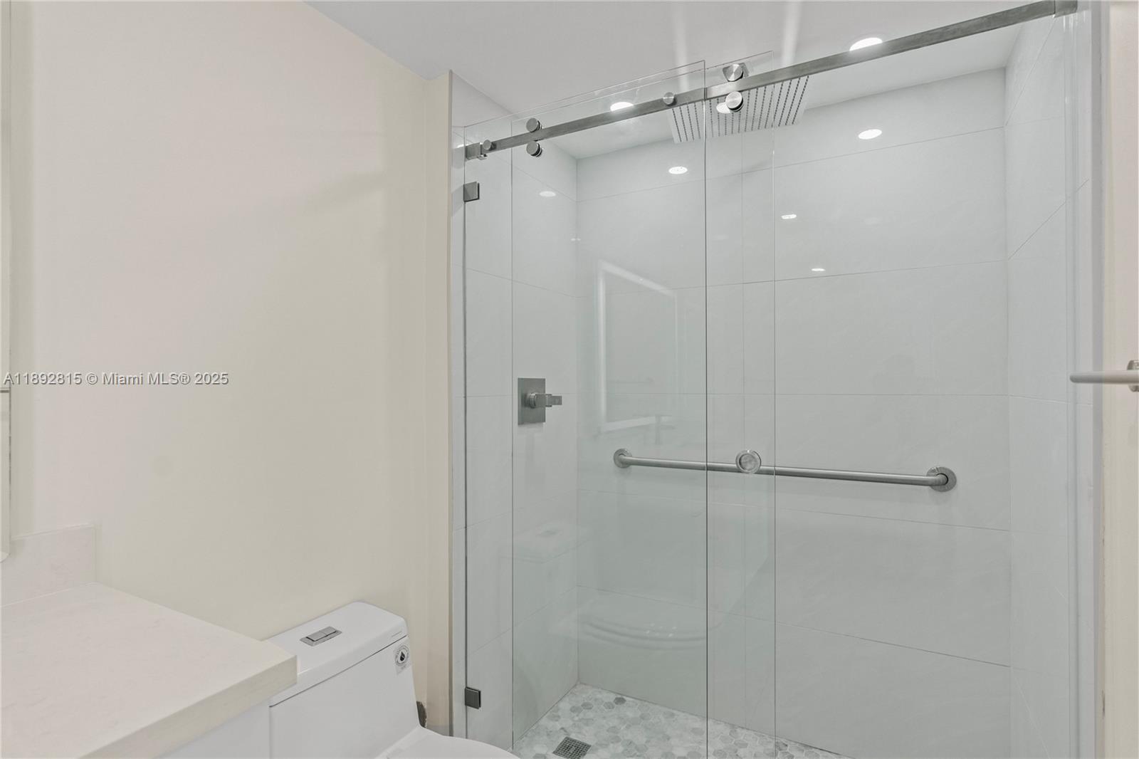 9055 Southwest 73rd Court, Unit 1502 Miami, FL 33156 - Photo 21 of 41 a bathroom with a shower and a toilet