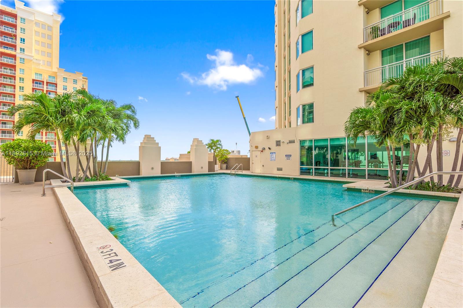 9055 Southwest 73rd Court, Unit 1502 Miami, FL 33156 - Photo 23 of 41 a view of a swimming pool with a patio