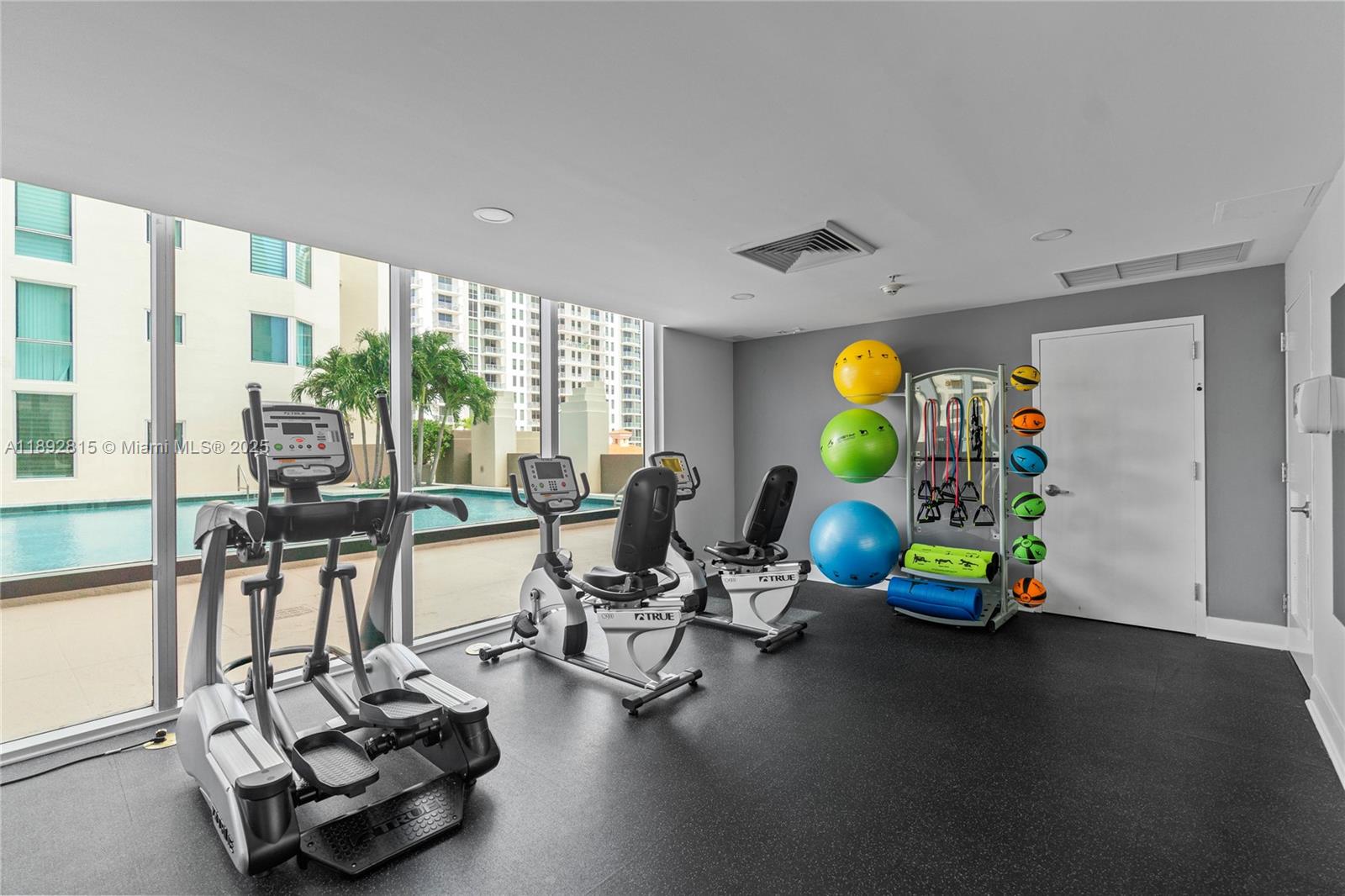9055 Southwest 73rd Court, Unit 1502 Miami, FL 33156 - Photo 26 of 41 a view of a room with gym equipment