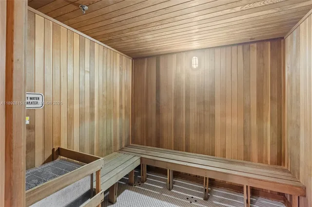 a bathroom with a window and a shower