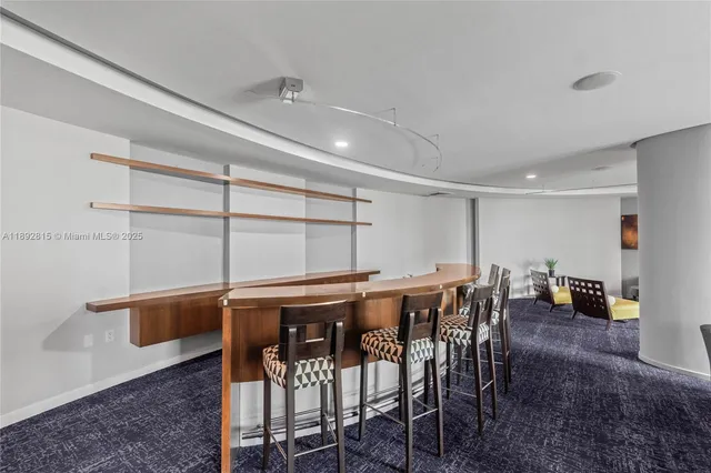 a living room with furniture and a mirror