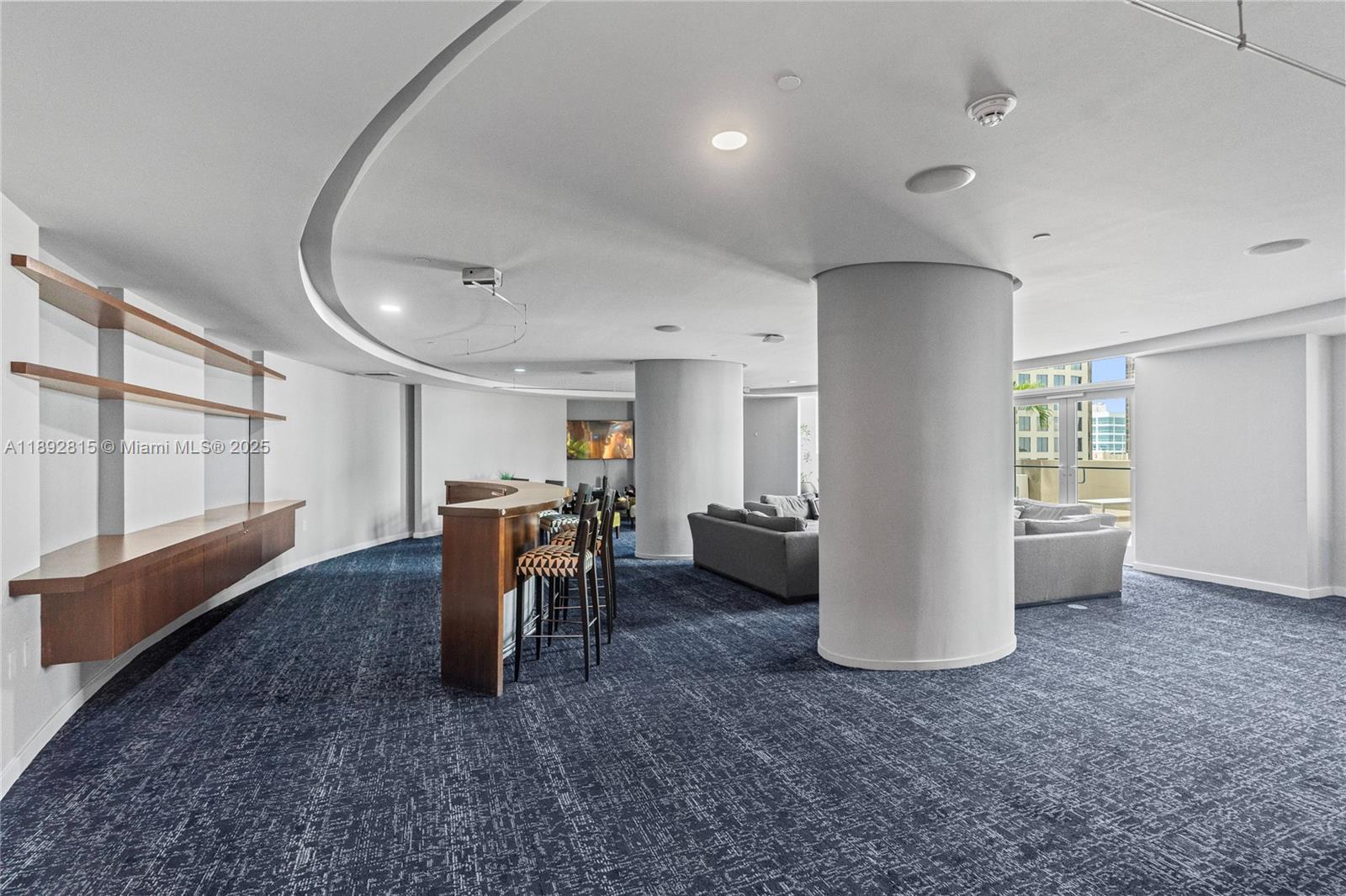 9055 Southwest 73rd Court, Unit 1502 Miami, FL 33156 - Photo 39 of 41 a view of a livingroom with furniture and a window