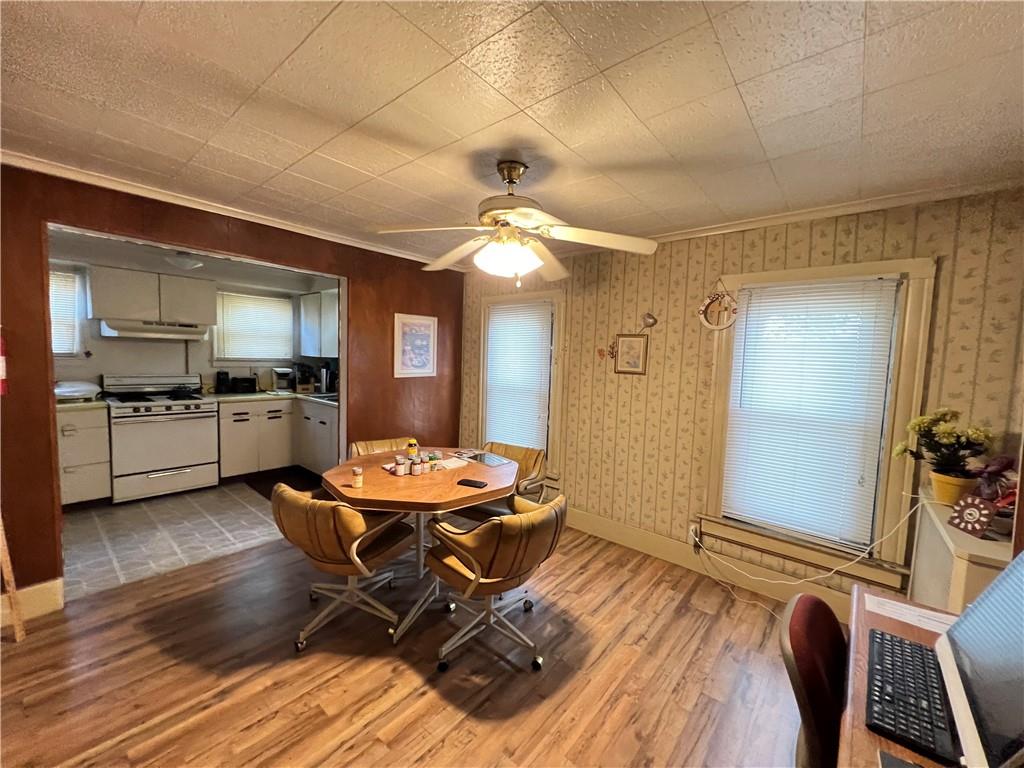 201 Jefferson Street Rochester, PA 15074 - Photo 15 of 23 a workspace with wooden floor and furniture