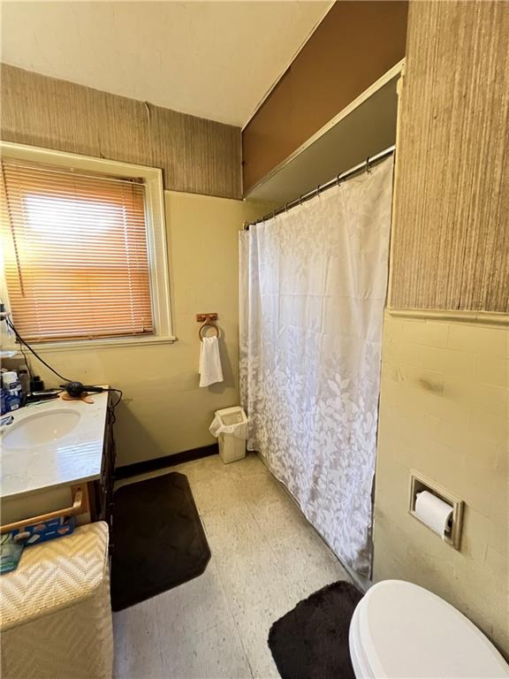 201 Jefferson Street Rochester, PA 15074 - Photo 21 of 23 a bathroom with a toilet sink and mirror