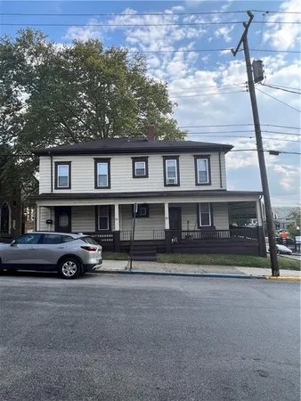 a car parked in front of a house