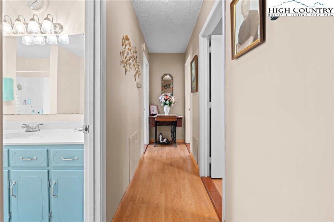 2598 Conner Circle Lenoir, NC 28645 - Photo 14 of 35 a view of a hallway view with wooden floor and staircase
