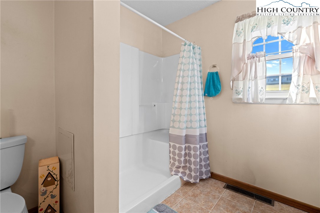 2598 Conner Circle Lenoir, NC 28645 - Photo 16 of 35 a bathroom with a shower