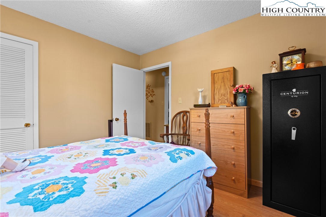 2598 Conner Circle Lenoir, NC 28645 - Photo 20 of 35 a bedroom with a bed and a dresser