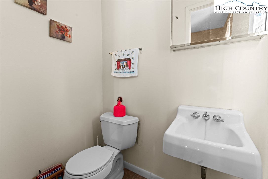 2598 Conner Circle Lenoir, NC 28645 - Photo 23 of 35 a bathroom with a sink and a toilet
