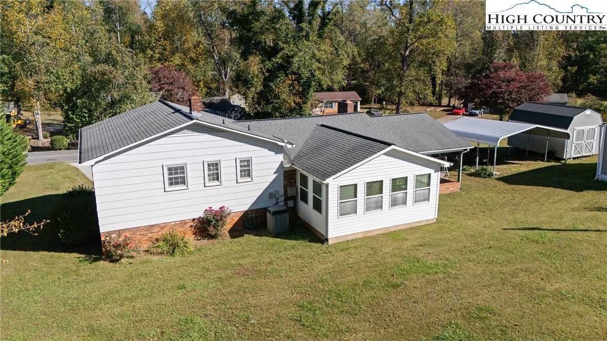 2598 Conner Circle Lenoir, NC 28645 - Photo 28 of 35 a front view of a house with a yard and garage