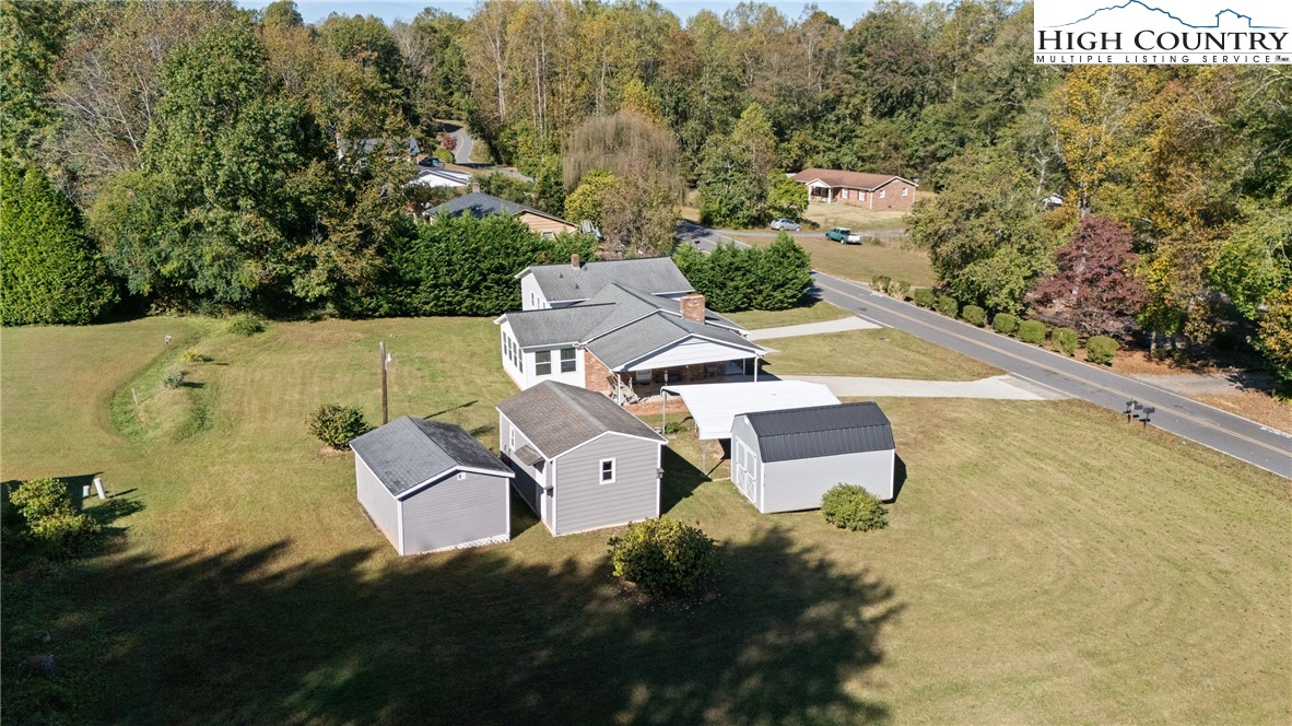 2598 Conner Circle Lenoir, NC 28645 - Photo 30 of 35 an aerial view of a house with swimming pool and garden