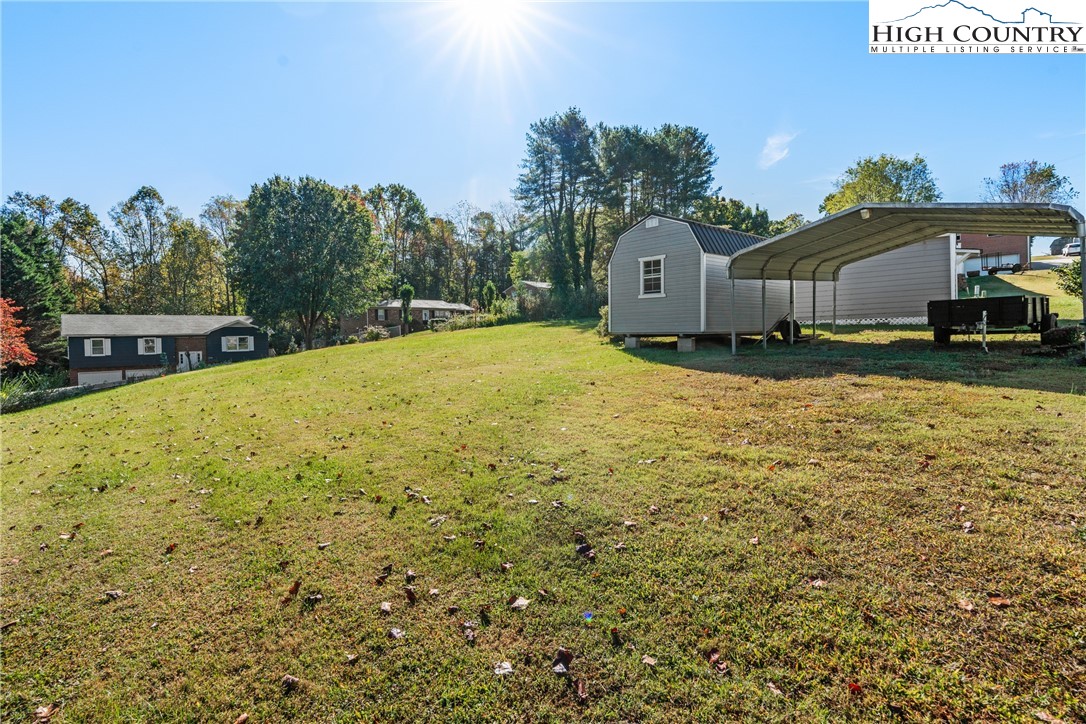 2598 Conner Circle Lenoir, NC 28645 - Photo 31 of 35 a swimming pool with outdoor seating and yard