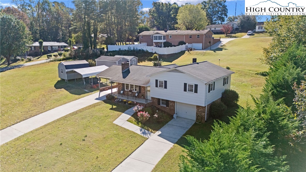 2598 Conner Circle Lenoir, NC 28645 - Photo 32 of 35 a aerial view of a house with swimming pool and large trees