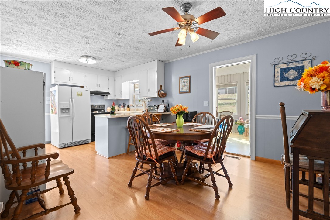 2598 Conner Circle Lenoir, NC 28645 - Photo 6 of 35 a view of a dining room with furniture and a kitchen