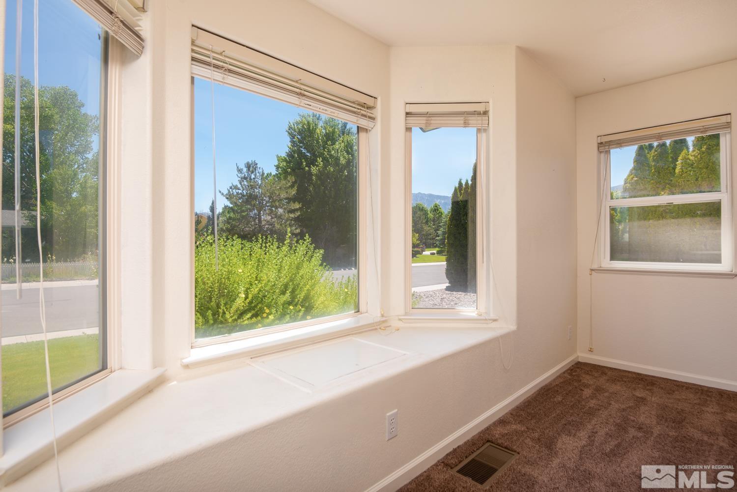 877 Longleaf Place Minden, NV 89423 - Photo 14 of 39 a view of a room that has a large window and front door