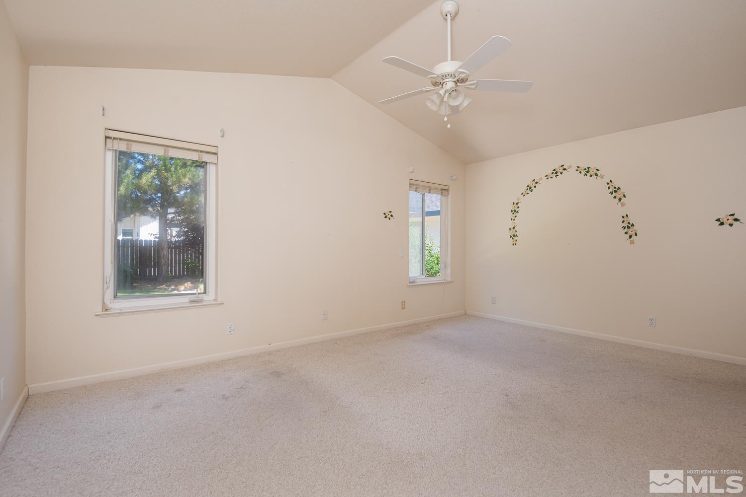 877 Longleaf Place Minden, NV 89423 - Photo 19 of 39 an empty room with windows and fan