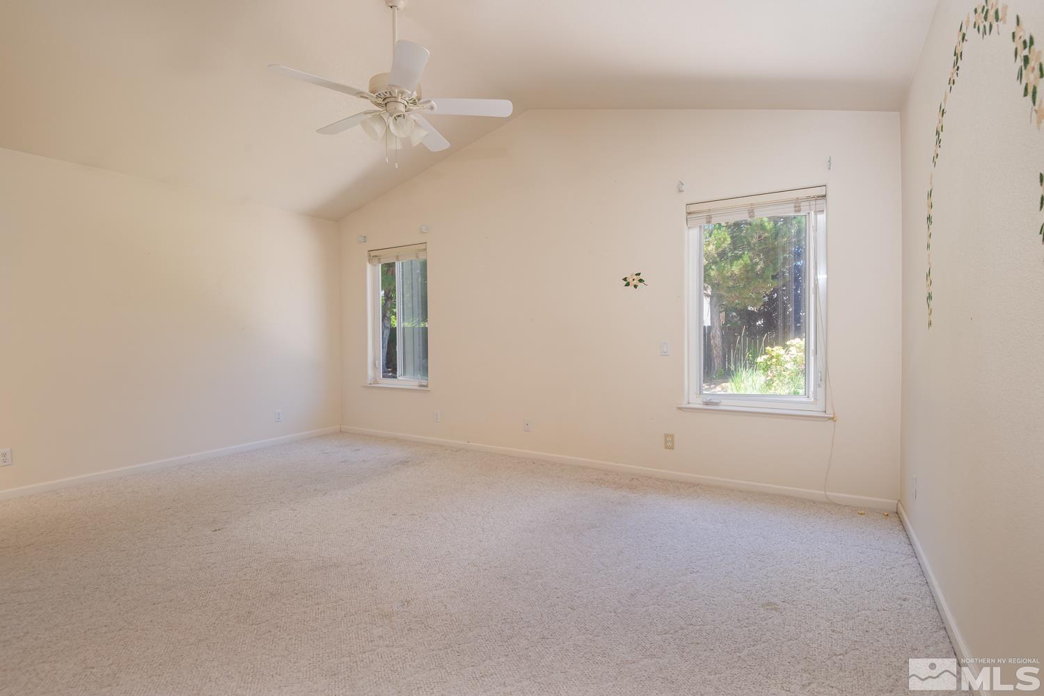 877 Longleaf Place Minden, NV 89423 - Photo 20 of 39 an empty room with a window and a fan