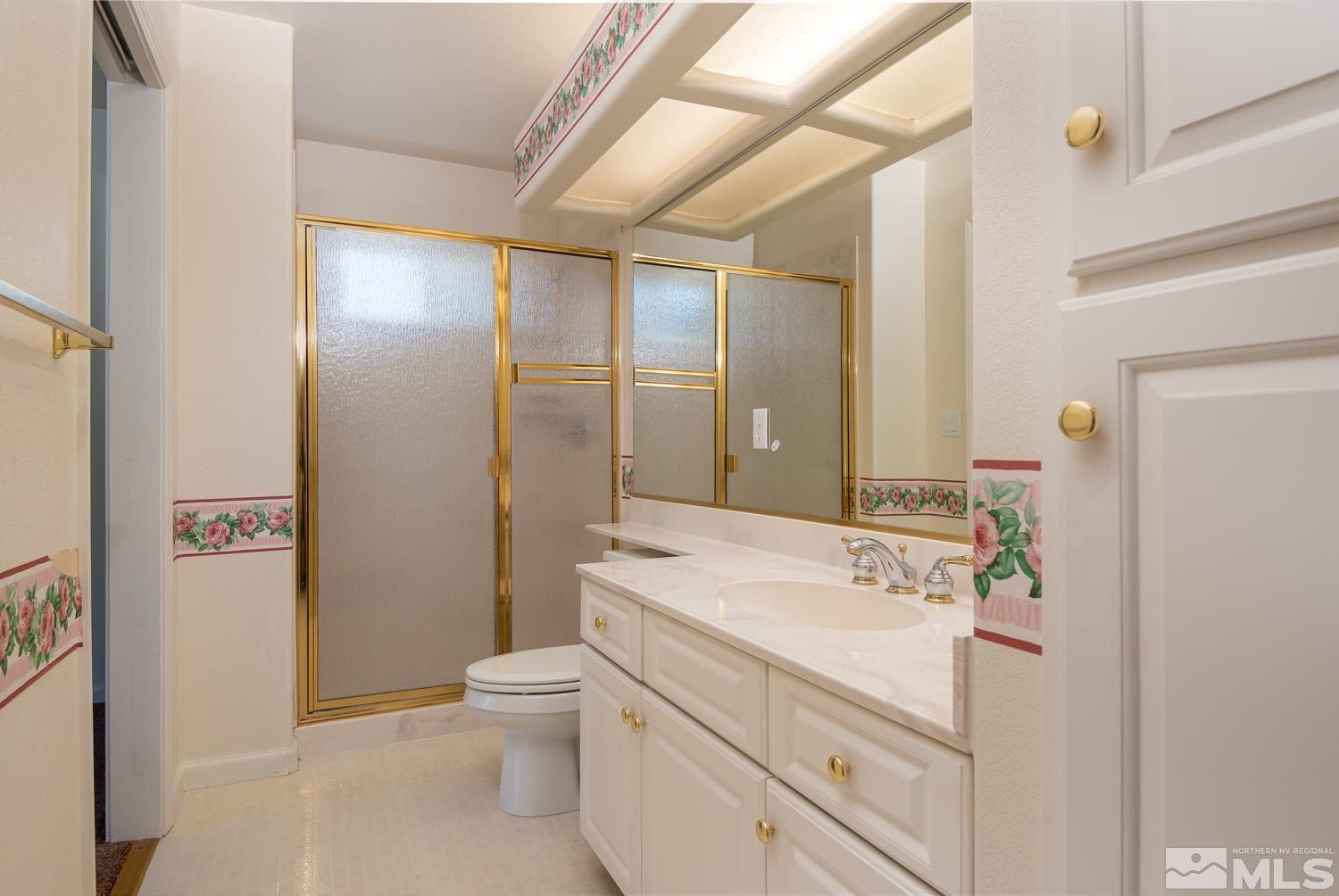 877 Longleaf Place Minden, NV 89423 - Photo 22 of 39 a bathroom with a sink a toilet and shower
