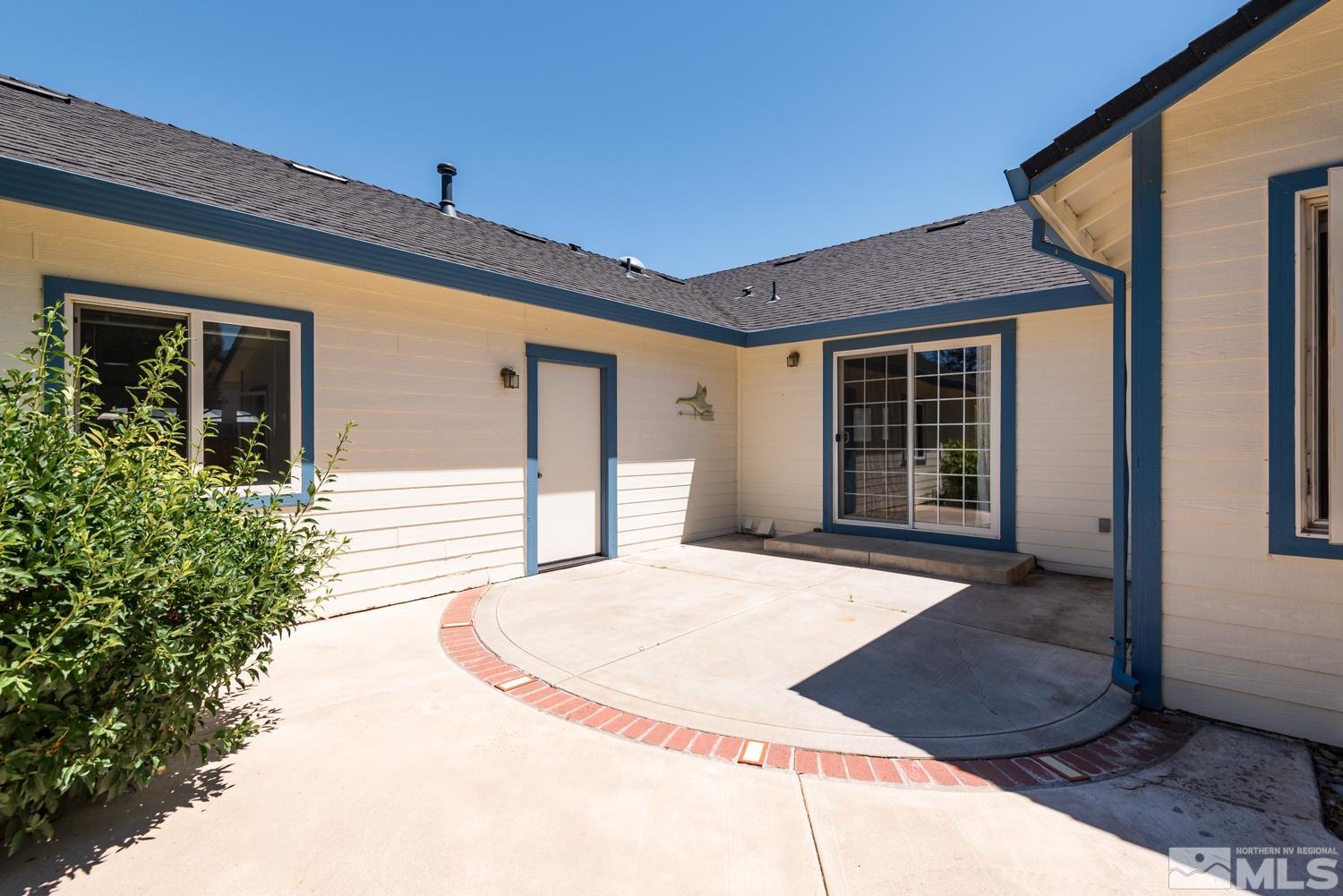 877 Longleaf Place Minden, NV 89423 - Photo 30 of 39 a front view of a house with a yard