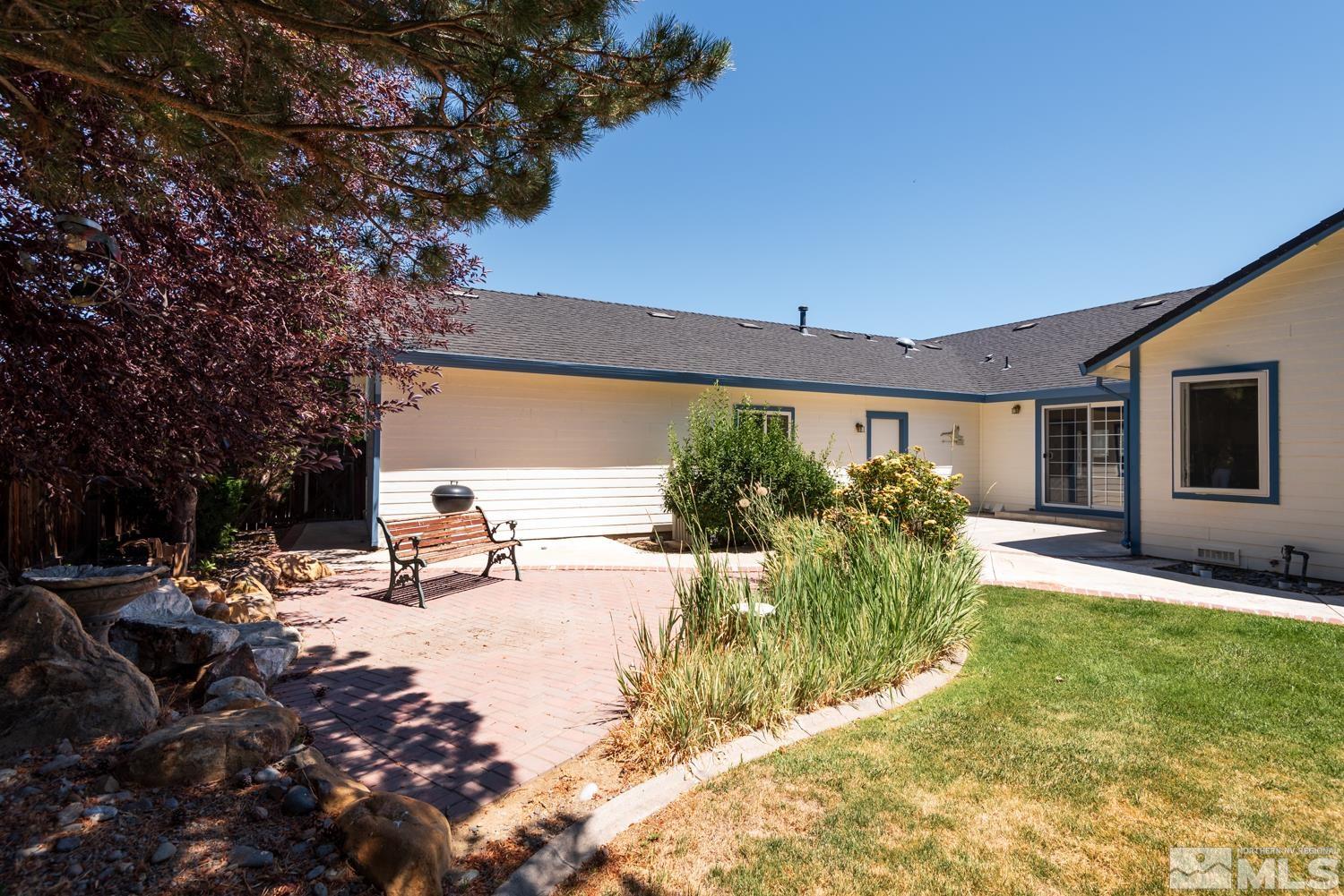 877 Longleaf Place Minden, NV 89423 - Photo 31 of 39 a view of a house with backyard and sitting area