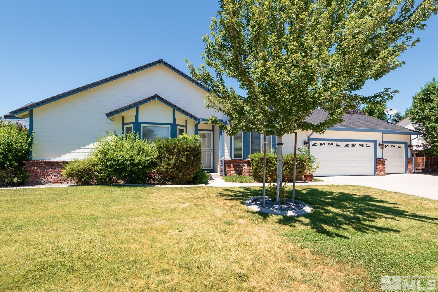 877 Longleaf Place Minden, NV 89423 - Photo 35 of 39 a house view with a garden space