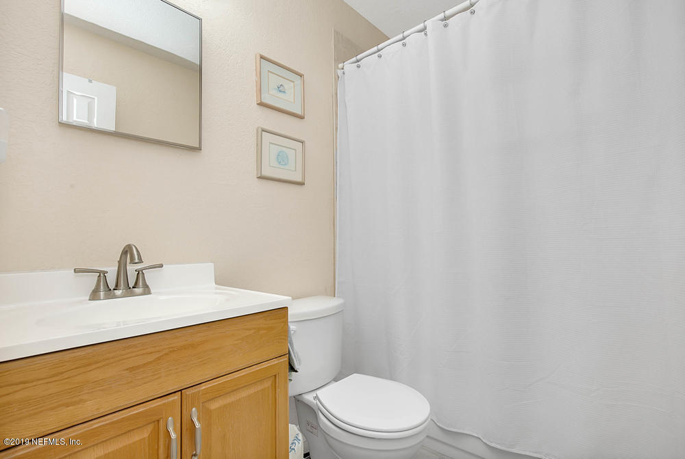 760 Triton Road Atlantic Beach, FL 32233 - Photo 17 of 24 a bathroom with a sink a toilet and vanity