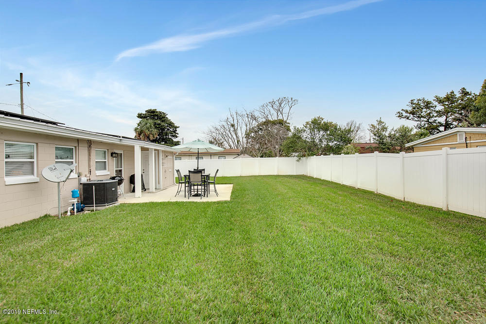 760 Triton Road Atlantic Beach, FL 32233 - Photo 22 of 24 a view of back yard of the house with green space