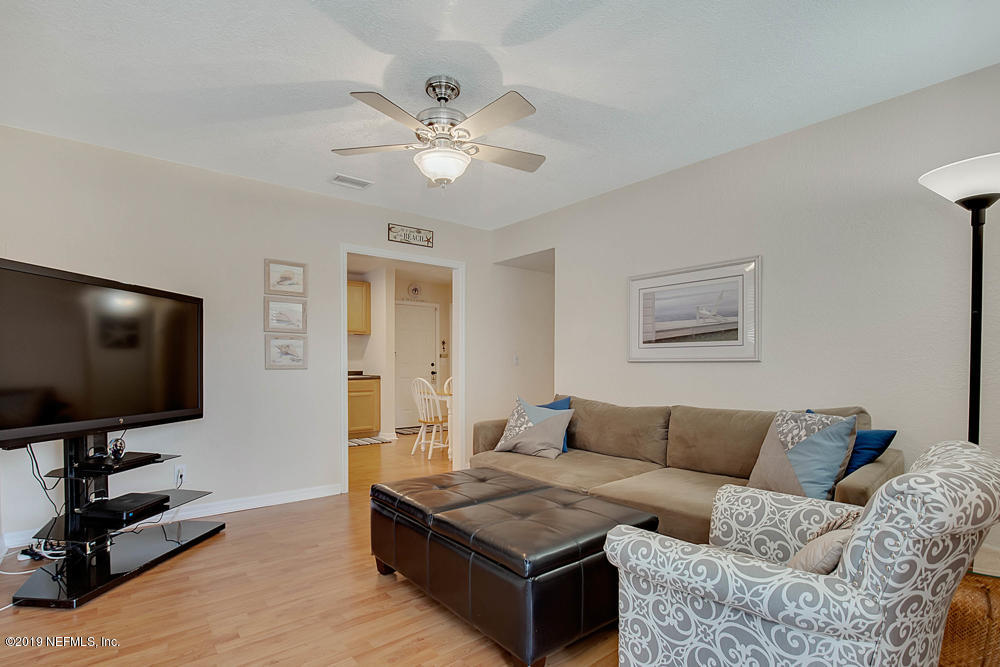 760 Triton Road Atlantic Beach, FL 32233 - Photo 8 of 24 a living room with furniture and a flat screen tv