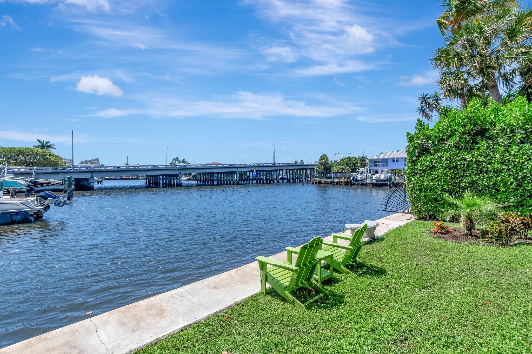 1700 South Ocean Boulevard, Unit 14 Delray Beach, FL 33483 - Photo 25 of 32 a view of a lake with houses in the back