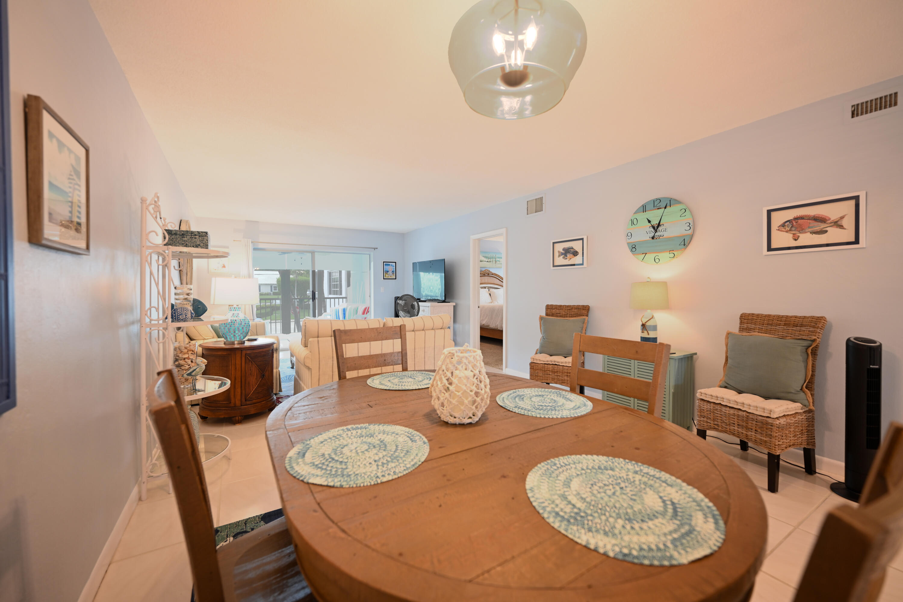 1700 South Ocean Boulevard, Unit 14 Delray Beach, FL 33483 - Photo 4 of 32 a dining room with furniture a rug and wooden floor