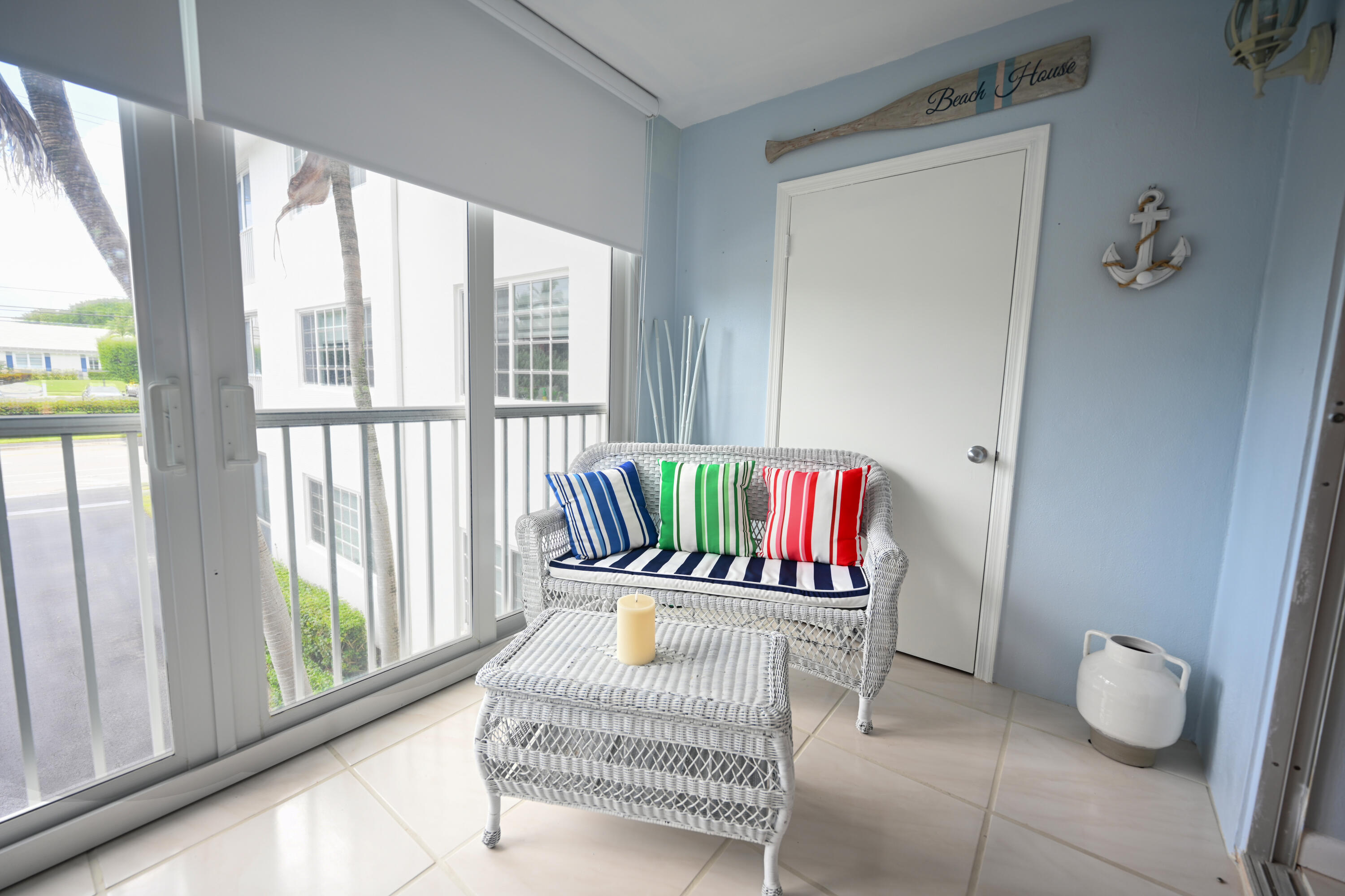 1700 South Ocean Boulevard, Unit 14 Delray Beach, FL 33483 - Photo 9 of 32 a living room with furniture and a window
