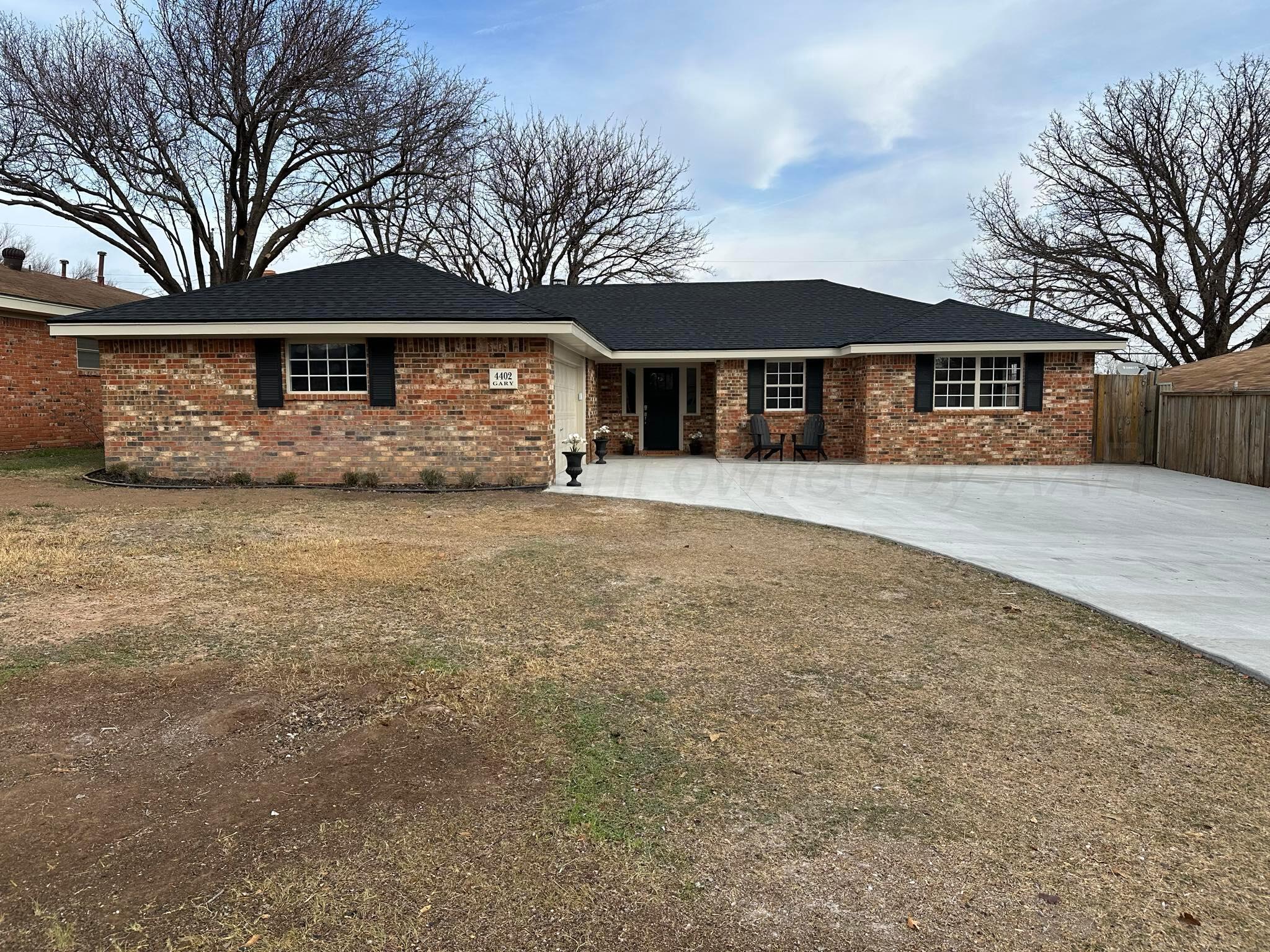 4402 Gary Lane Amarillo, TX 79110 - Photo 1 of 19 a front view of a house with a yard