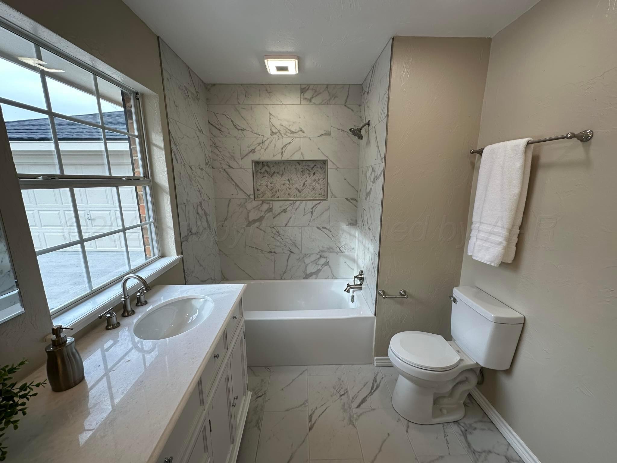 4402 Gary Lane Amarillo, TX 79110 - Photo 11 of 19 a bathroom with a sink a toilet and shower