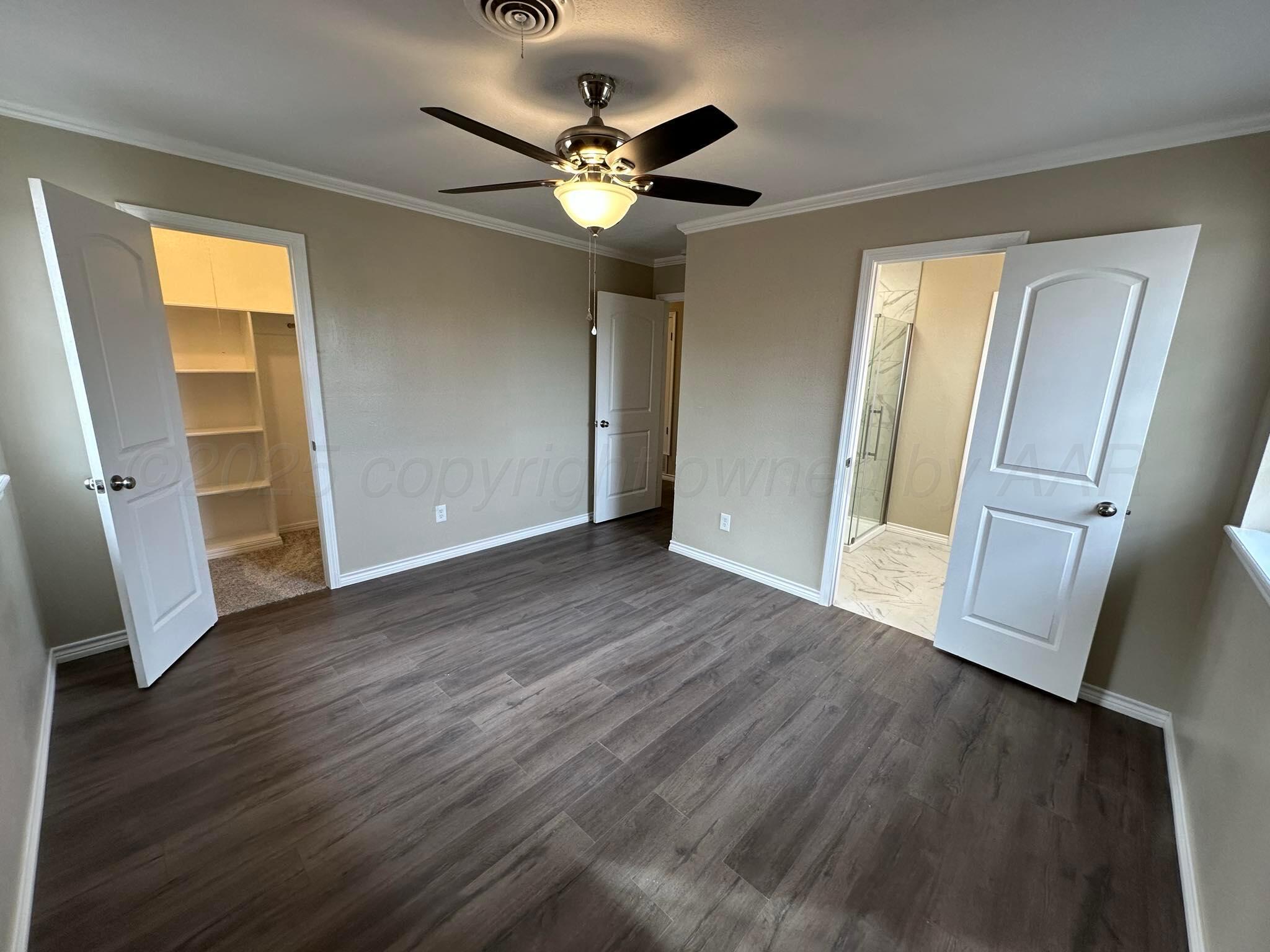 4402 Gary Lane Amarillo, TX 79110 - Photo 15 of 19 wooden floor in an empty room with a window
